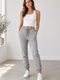 Female model in grey joggers